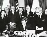 JFK Signs Postal Union Agreement